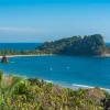 panoramic view of Manuel Antonio beach and forested coastline in Costa Rica