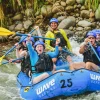 excited group whitewater rafting on a river in Costa Rica with WAVE