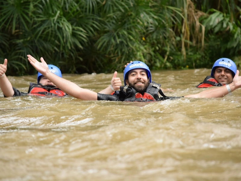 Rafters enjoying a swim break during a calm section of the Arenal rafting tour.