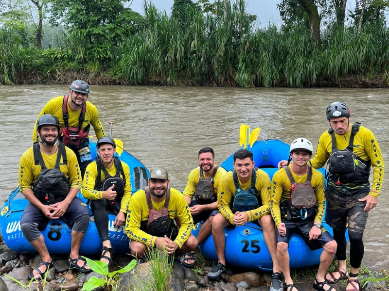 Wave Expeditions rafting guides posing with a group before an Arenal rafting tour.