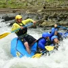 Rafting guide leading Wave team through whitewater rapids in Costa Rica