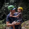 Father and young son smiling after a canyoning descent – Wave adventure in Costa Rica
