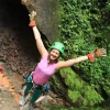Happy mom rappelling down a canyon wall in La Fortuna – adventure tour with Wave